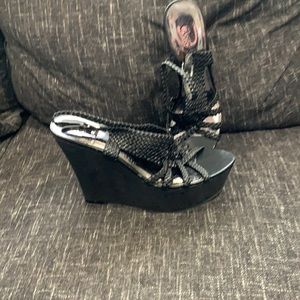 Black Carlos by Carlos Santana wedge sandals.